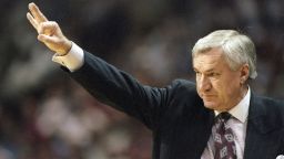 Coach Dean Smith of the North Carolina Tarheels gives instructions to his players during a playoff game in March 1997.