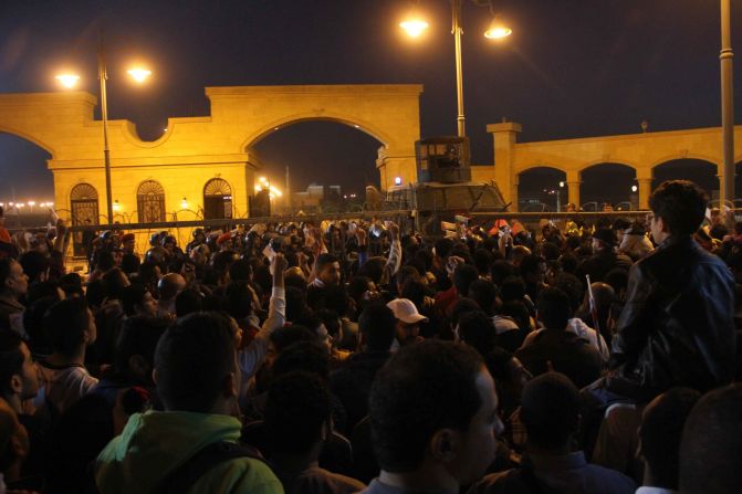 Soccer fans confront police outside a stadium in Cairo on Sunday, February 8. At least 19 people were killed in violent clashes ahead of a scheduled match between Zamalek and ENPPI, the Health Ministry said.