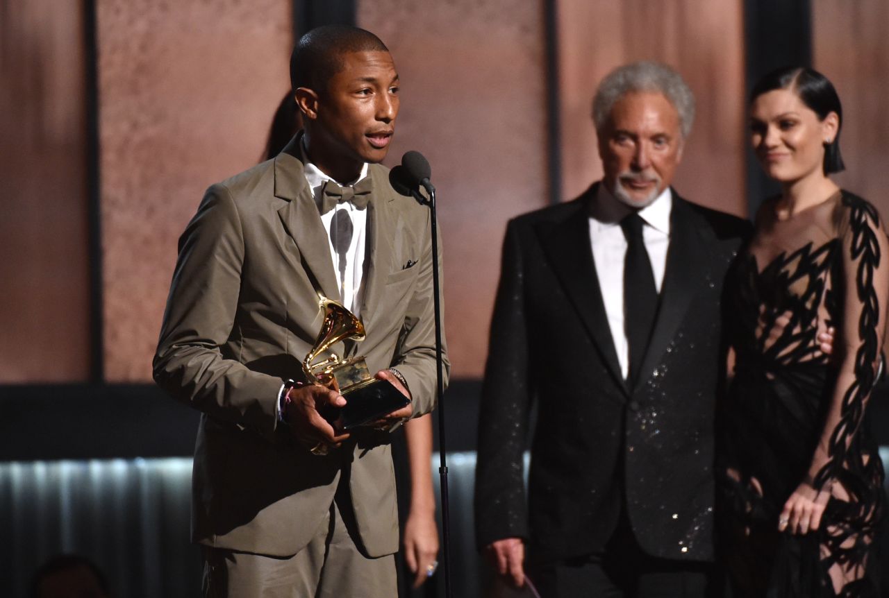 Pharrell Williams accepts the Grammy for Best Pop Solo Performance for "Happy (Live)." The song also earned the Best Music Video award, and Pharrell's "Girl" was named Best Urban Contemporary Album.