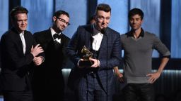 William Phillips, from left, James Napier and Sam Smith accept the award for song of the year for "Stay With Me" at the 57th annual Grammy Awards on Sunday, Feb. 8, 2015, in Los Angeles. (Photo by John Shearer/Invision/AP)