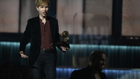 Beck watches Kanye West leave the stage at the Grammy Awards in Los Angeles on Sunday.