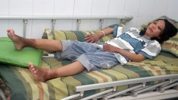 Sulistyaningsih lies on a hospital bed before leaving on February 5, 2014.