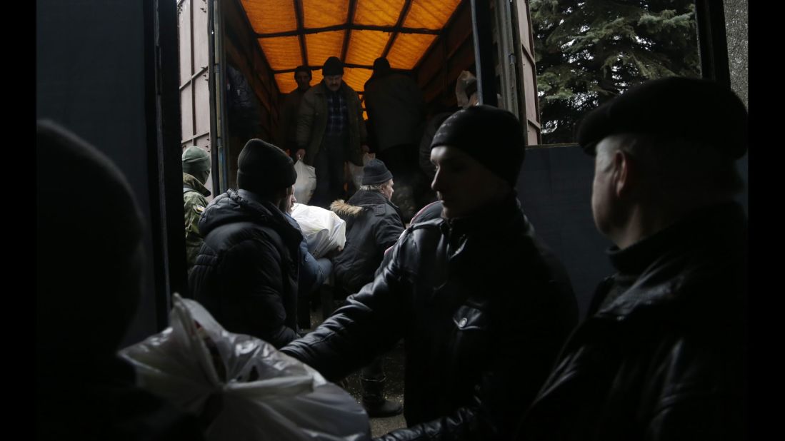 Residents unload humanitarian aid in Debaltseve on Friday, February 6.