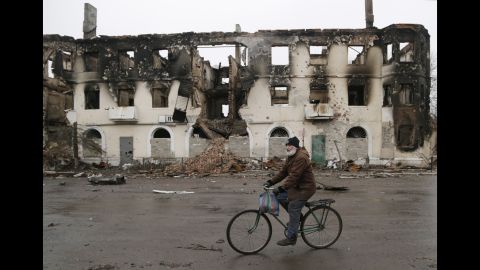 A man rides a bicycle in Vuhlehirsk, Ukraine, on February 6.