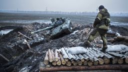 A pro-Russian rebel guards a captured former Ukrainian Army checkpoint outside Vuhlehirsk on Thursday, February 5.