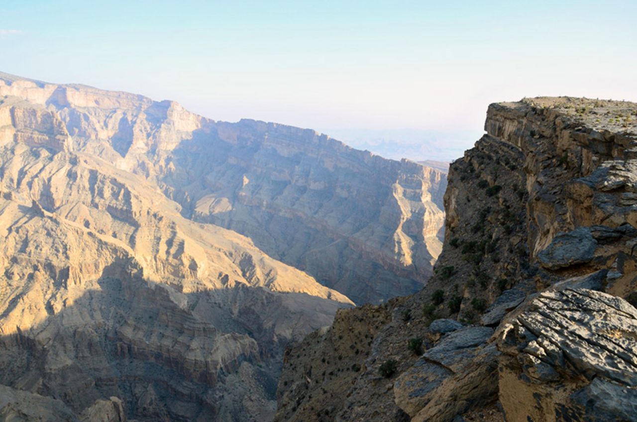 From the peaks of the Al Hajar Mountains, Wadi Ghul drops down almost one kilometer. 