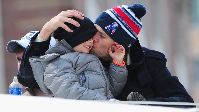 New England Patriots quarterback Tom Brady kisses his son Benjamin during a Super Bowl victory parade held Wednesday, February 4, in Boston. Brady was named <a href="index.php?page=&url=http%3A%2F%2Fwww.cnn.com%2F2015%2F01%2F25%2Fus%2Fgallery%2Fsuper-bowl-mvps%2Findex.html" target="_blank">Most Valuable Player</a> after the Patriots defeated Seattle 28-24 in <a href="index.php?page=&url=http%3A%2F%2Fwww.cnn.com%2F2015%2F02%2F01%2Fus%2Fgallery%2Fsuper-bowl-xlix%2Findex.html" target="_blank">Super Bowl XLIX.</a>