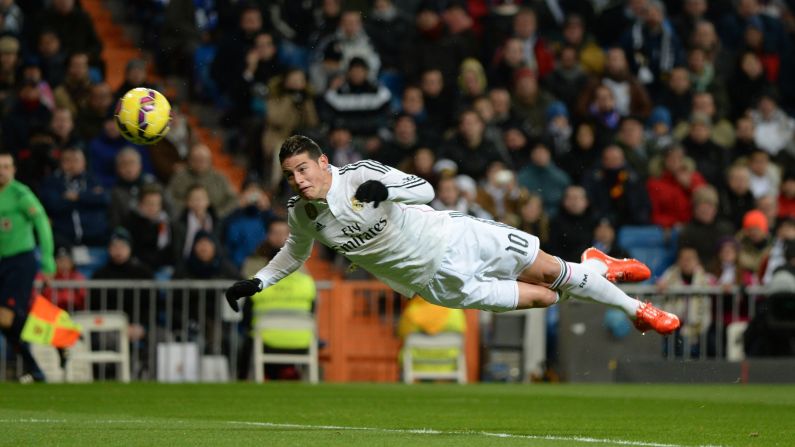 James Rodriguez heads in a goal for Real Madrid during a Spanish league match against Sevilla on Wednesday, February 4. Madrid won the home match 2-1.