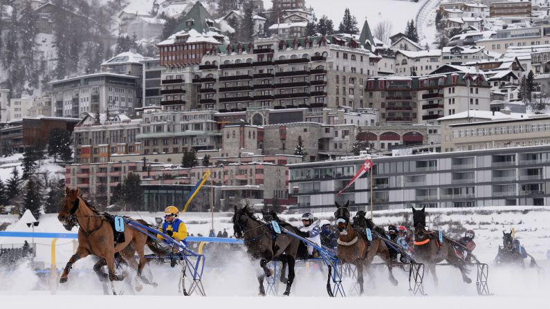 Trotters race in the snow Sunday, February 8, in St. Moritz, Switzerland.