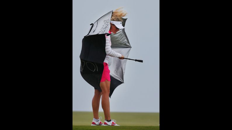 Suzann Pettersen takes cover under an umbrella during the first round of the Bahamas LPGA Classic on Thursday, February 5.