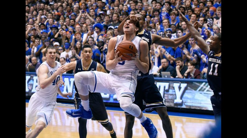 Duke's Grayson Allen is fouled by Notre Dame's V.J. Beachem during a game Saturday, February 7, in Durham, North Carolina. 