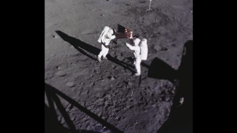 Armstrong and Aldrin place the American flag on the moon. This image was captured by the Apollo 11 data acquisition camera that was mounted to the lunar module Eagle.