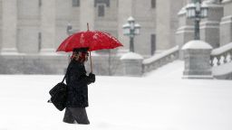 A pedestrian walks through morning snow in Albany, New York, on February 9.