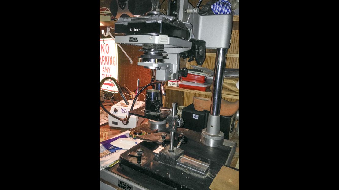 Peres attached his camera lens to a bellows atop a microscope in this homemade set-up.