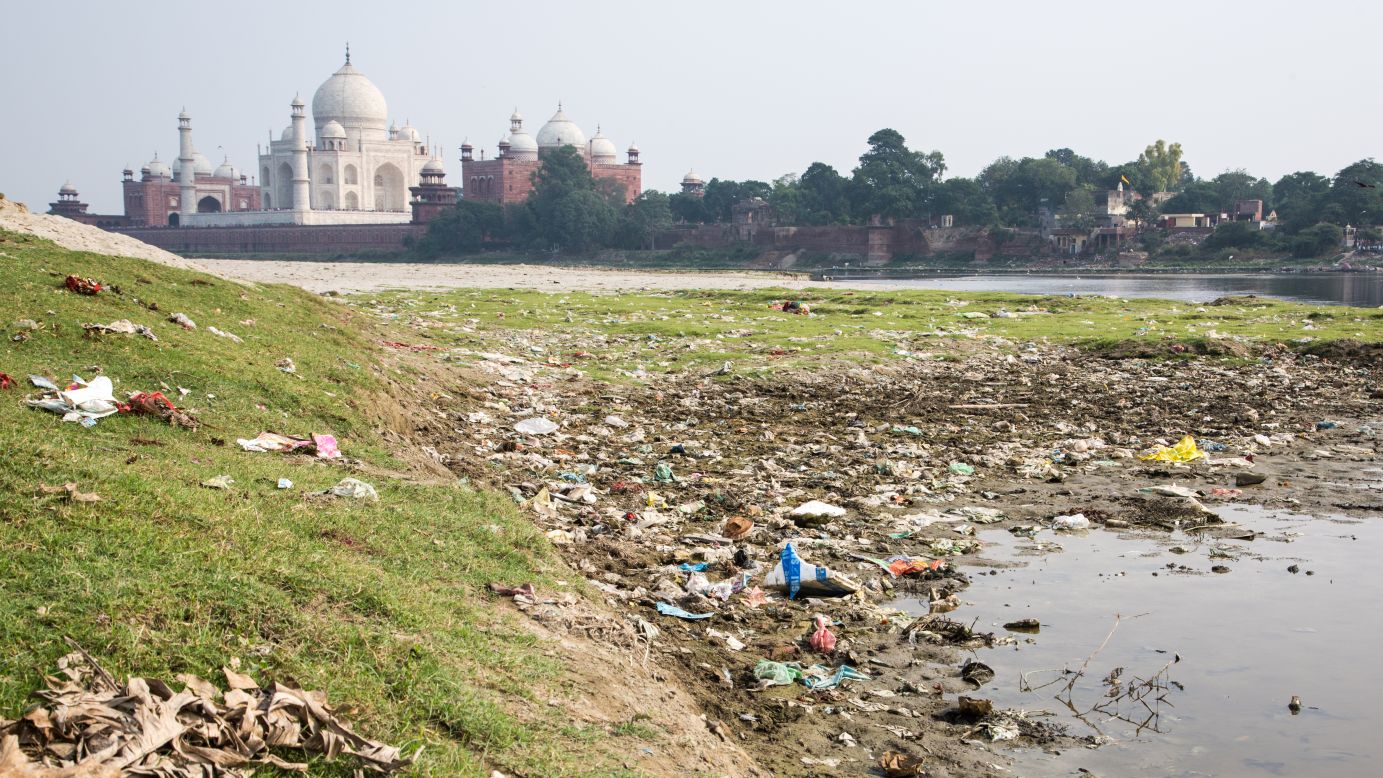 A less pristine vantage point littered with waste is just across the river from the Taj Mahal.