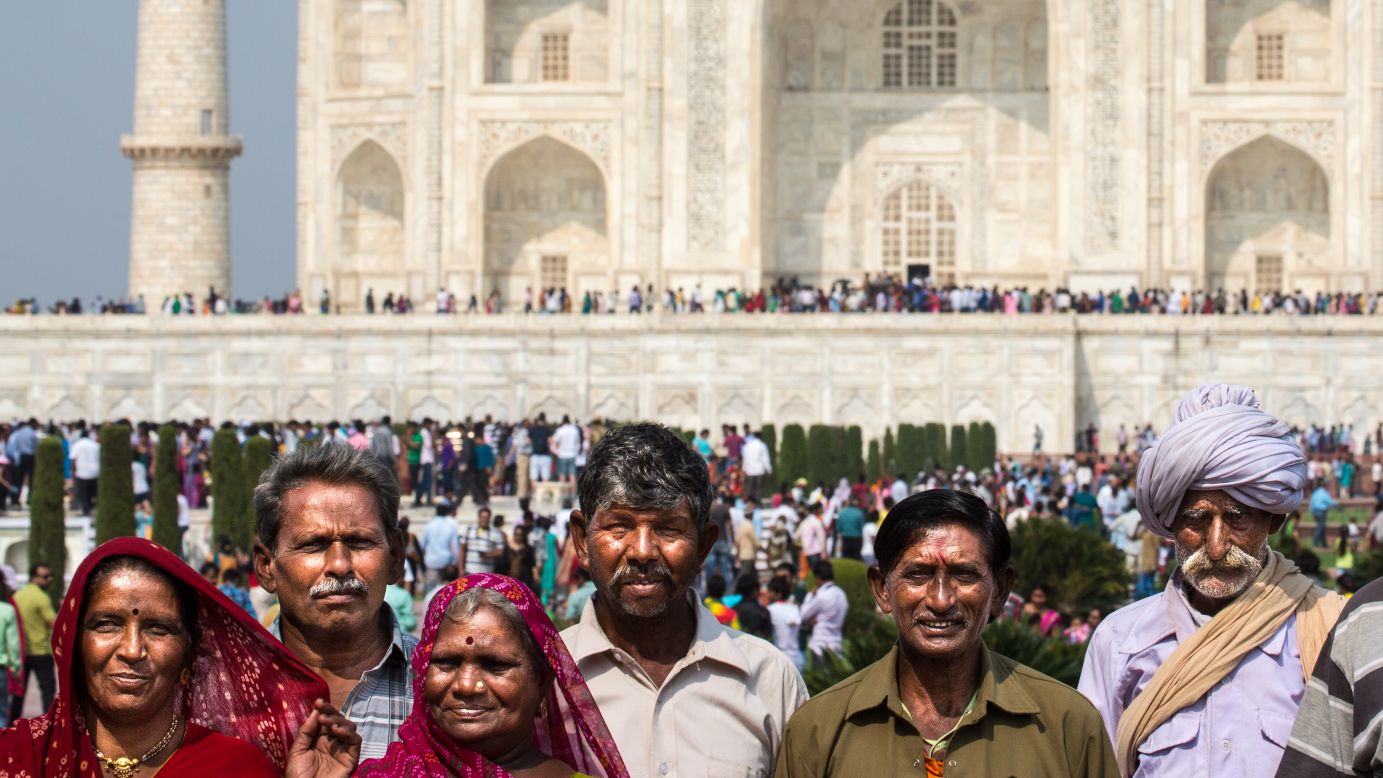 Visitors to the Taj Mahal pose for a picture together near the water devices. An estimated 3 million people will visit the UNESCO World Heritage site each year.