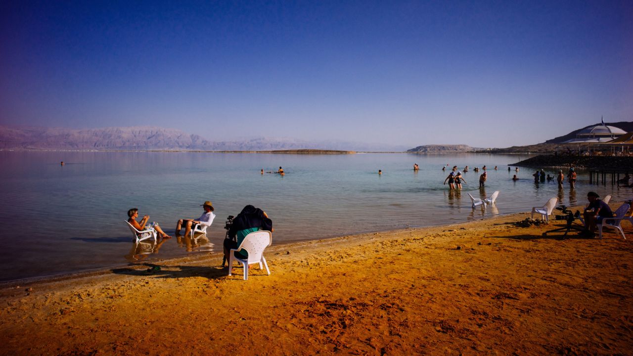 The "Wonder List" crew films an interview with a local artist, Sigalit Landau, near the evaporation ponds of the Dead Sea.