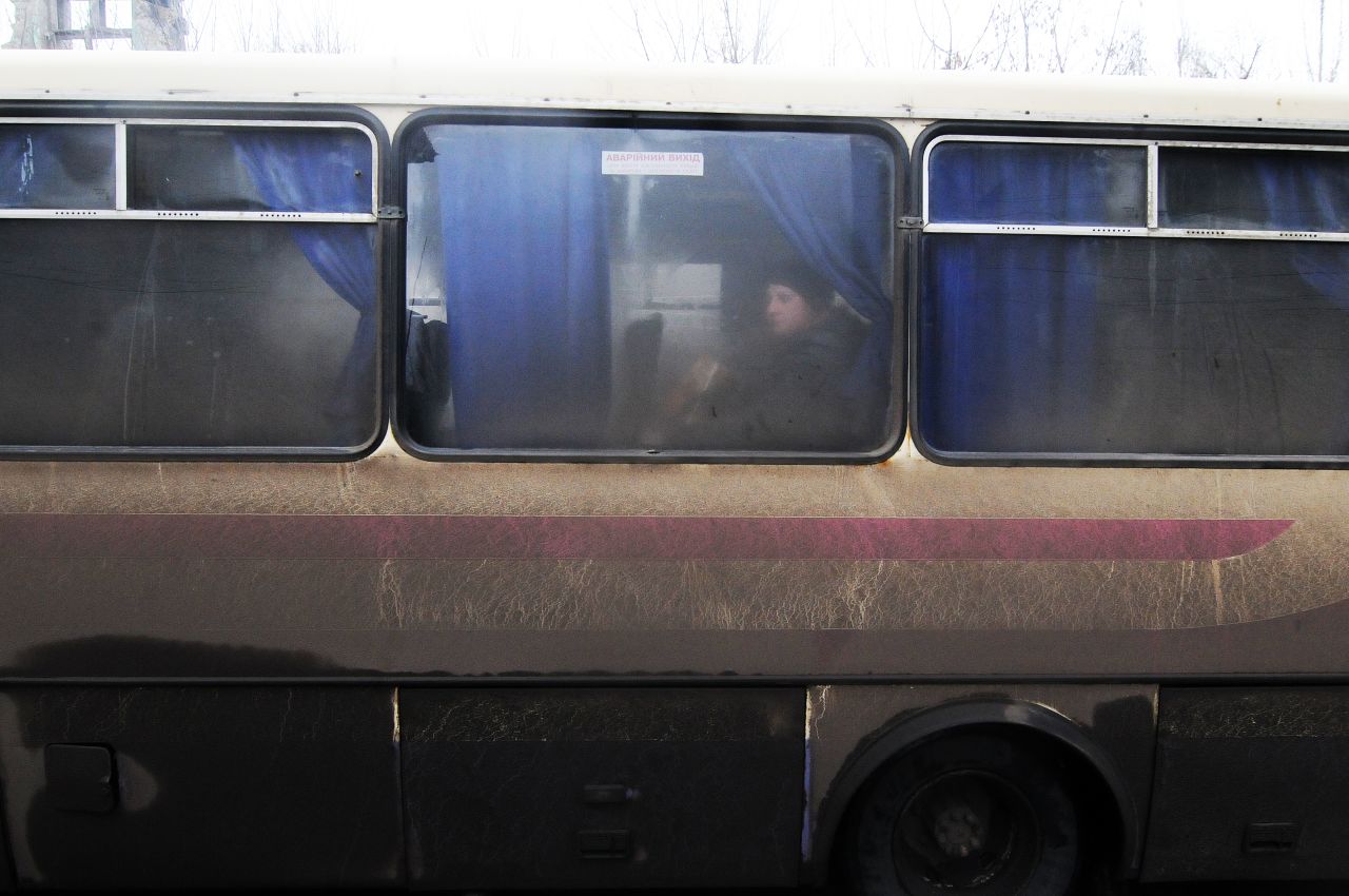 A few residents board a bus to escape the fighting. The road leading to nearby Artyemovsk is a very dangerous route because of shelling by separatists. 
