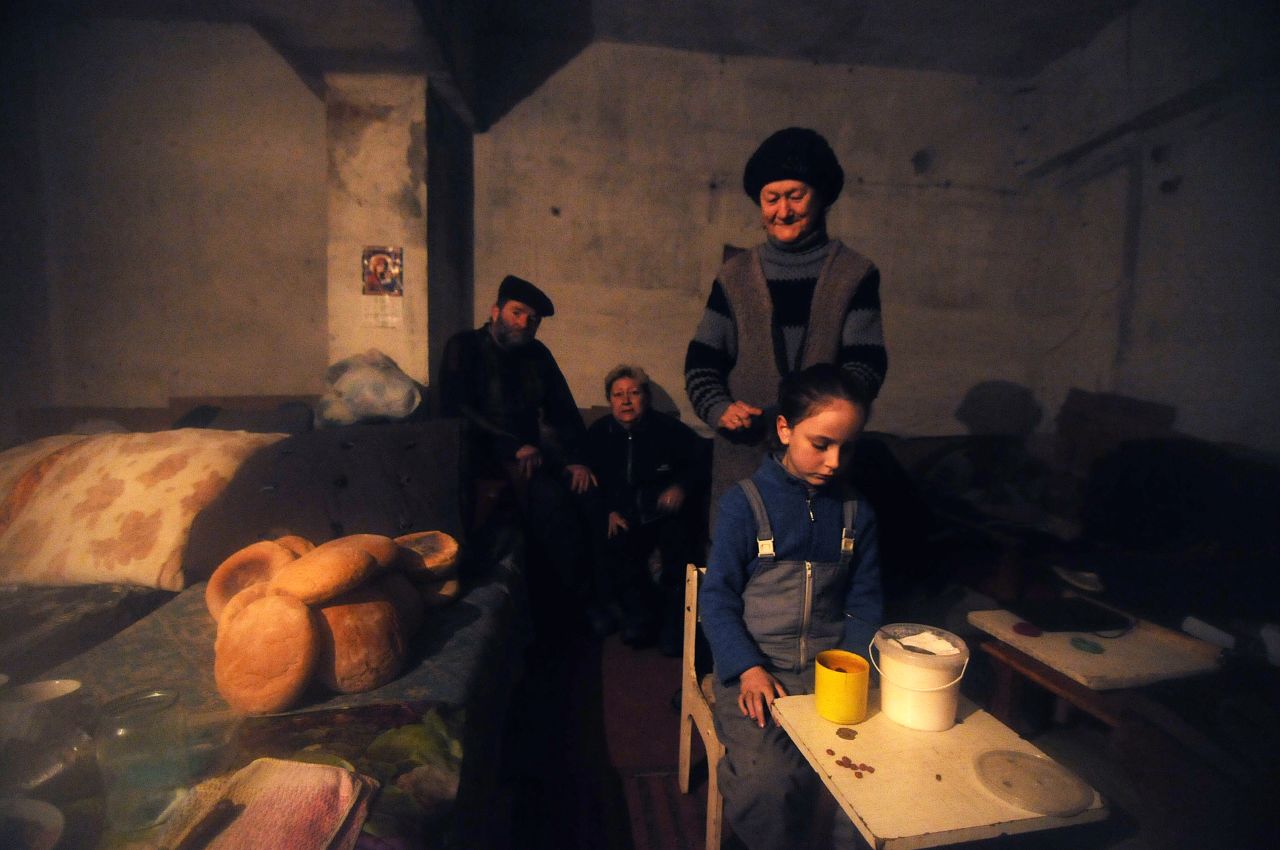 A Debaltseve family has taken refuge in an underground bunker because of the constant shelling. About one third of the houses in the town have been hit by artillery. 