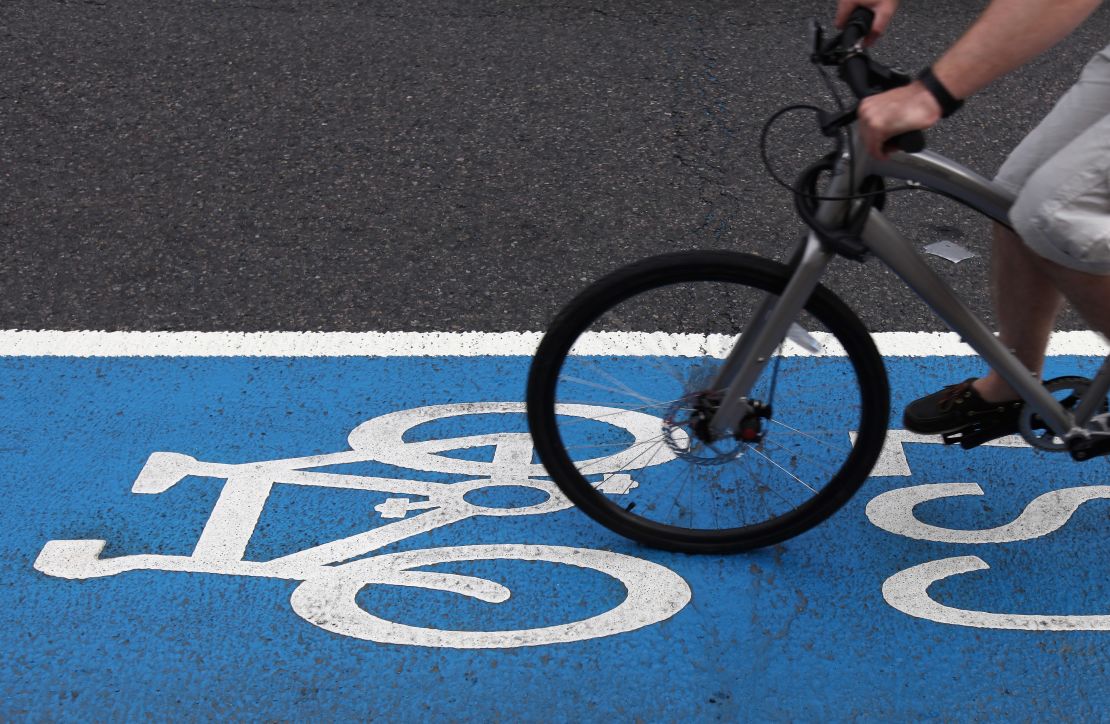 A cyclist rides along a section of London's cycle superhighway.