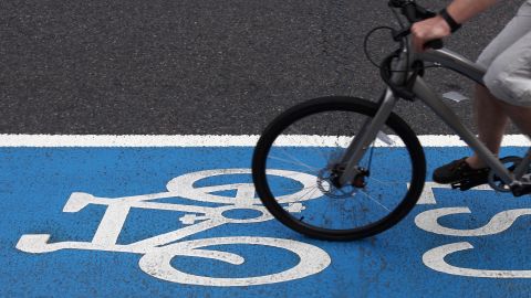 A cyclist rides along a section of London's cycle superhighway.