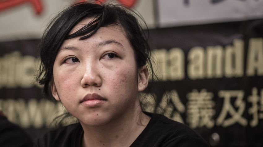 Indonesian former maid Erwiana Sulistyaningsih attends a press conference in Hong Kong on February 10, 2015 after her employer was convicted of beating her in a 'torture' case that sparked international outrage and spotlighted the plight of migrant domestic workers in the Middle East and Asia. The verdict, read out to a packed courtroom, was met with cheers by activists and supporters of Sulistyaningsih, who has become the face of a campaign for improved workers' rights in the financial hub. AFP PHOTO / Philippe Lopez (Photo credit should read PHILIPPE LOPEZ/AFP/Getty Images)