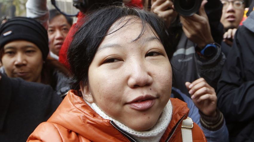 Indonesian maid Erwiana Sulistyaningsih arrives at a court in Hong Kong, Tuesday, Feb. 10, 2015. A Hong Kong woman who was accused of torturing her Indonesian maid in a case that sparked outrage for the scale of its brutality was convicted of a slew of assault and other charges on Tuesday. A judge found Law Wan-tung guilty of 18 charges that also included criminal intimidation and failure to pay wages or give time off work to Sulistyaningsih.(AP Photo/Kin Cheung)