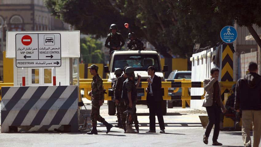 Caption:Yemeni security forces stand guard outside the French embassy where takes place a demonstration against the publication of a new cartoon of the Prophet Mohammed by satirical magazine Charlie Hebdo on January 17, 2015 in the capital Sanaa. The cover cartoon of Mohammed carried by Charlie Hebdo on January 14, in its first edition since an attack on its Paris offices claimed by Al-Qaeda killed 12 people on January 7, has sparked angry protests across the Muslim world. AFP PHOTO / MOHAMMED HUWAIS (Photo credit should read MOHAMMED HUWAIS/AFP/Getty Images)
