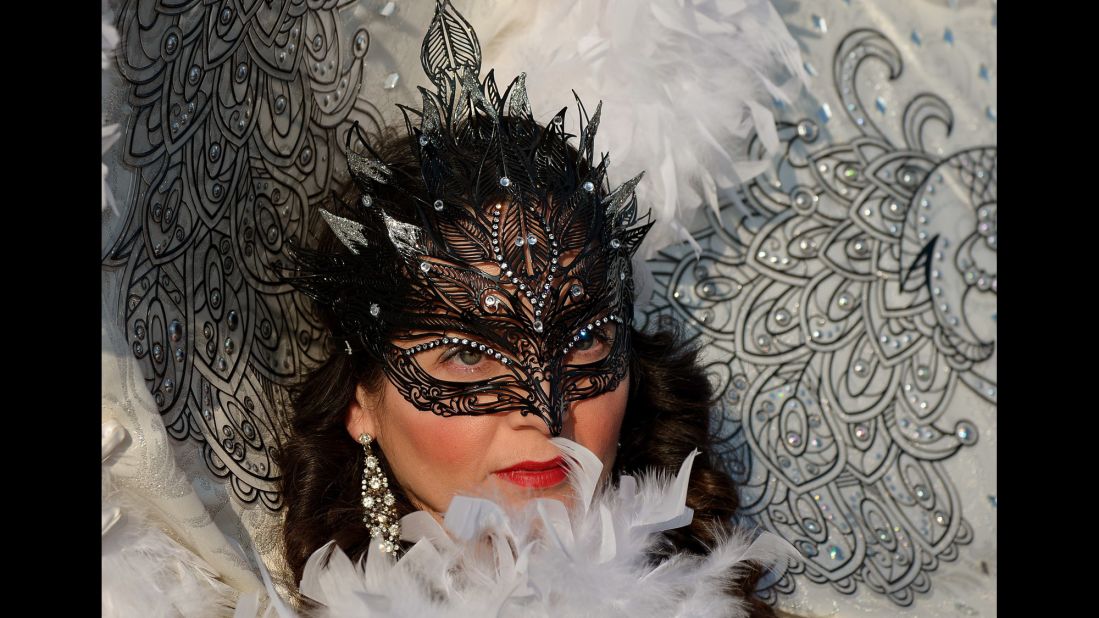 A costumed reveler poses at St. Mark's Square in Venice, Italy, during the Venice Carnival on Sunday, February 8.