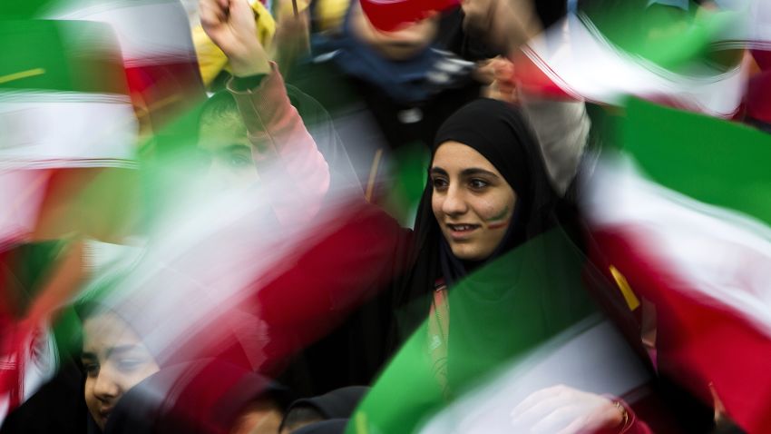 Iranian schoolgirls wave their national flag during the 36th anniversary of the Islamic revolution in Tehran's Azadi Square (Freedom Square) on February 11, 2015. President Hassan Rouhani delivered a speech saying the world needs Iran to help stabilise the troubled Middle East, in remarks pointing to wider ramifications of a deal over its disputed nuclear programme.