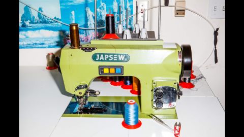 A vibrant sewing machine in Johnathan Behr's Los Angeles tailoring shop.