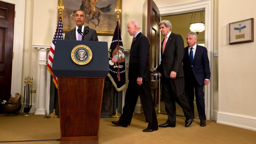 President Barack Obama, followed by Vice President Joe Biden, Secretary of State John Kerry, and Defense Secretary Chuck Hagel, approaches the podium in the Roosevelt Room of the White House in Washington, Wednesday, Feb. 11. 2015, to speak about the Islamic State group. Obama asked the U.S. Congress on Wednesday to authorize military force to "degrade and defeat" Islamic State forces in the Middle East without sustained, large-scale U.S. ground combat operations, setting lawmakers on a path toward their first war powers vote in 13 years. (AP Photo/Jacquelyn Martin)