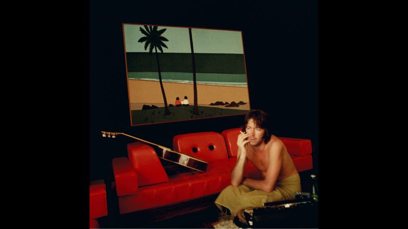 "I took this shot while on my first tour of America with Eric and his band. This was just one of the hotels we stayed in. I particularly liked the hideous red frame of the picture on the wall matching the sofa and the small figure in the painting," Boyd said. 