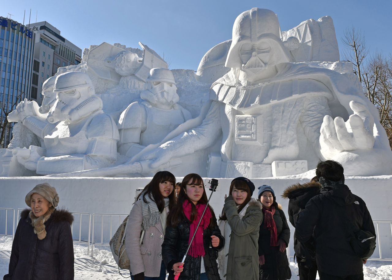 "You know how wide this <a href="http://edition.cnn.com/2015/02/05/travel/gallery/sapporo-snow-star-wars/">Darth Vader ice sculpture</a> is? Too wide for me to capture with my puny human arm."