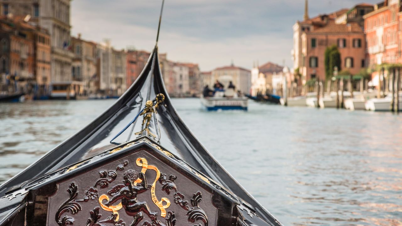 The bow of champion gondolier Giampaolo D'Este's gondola, cutting its way through the Grand Canal.