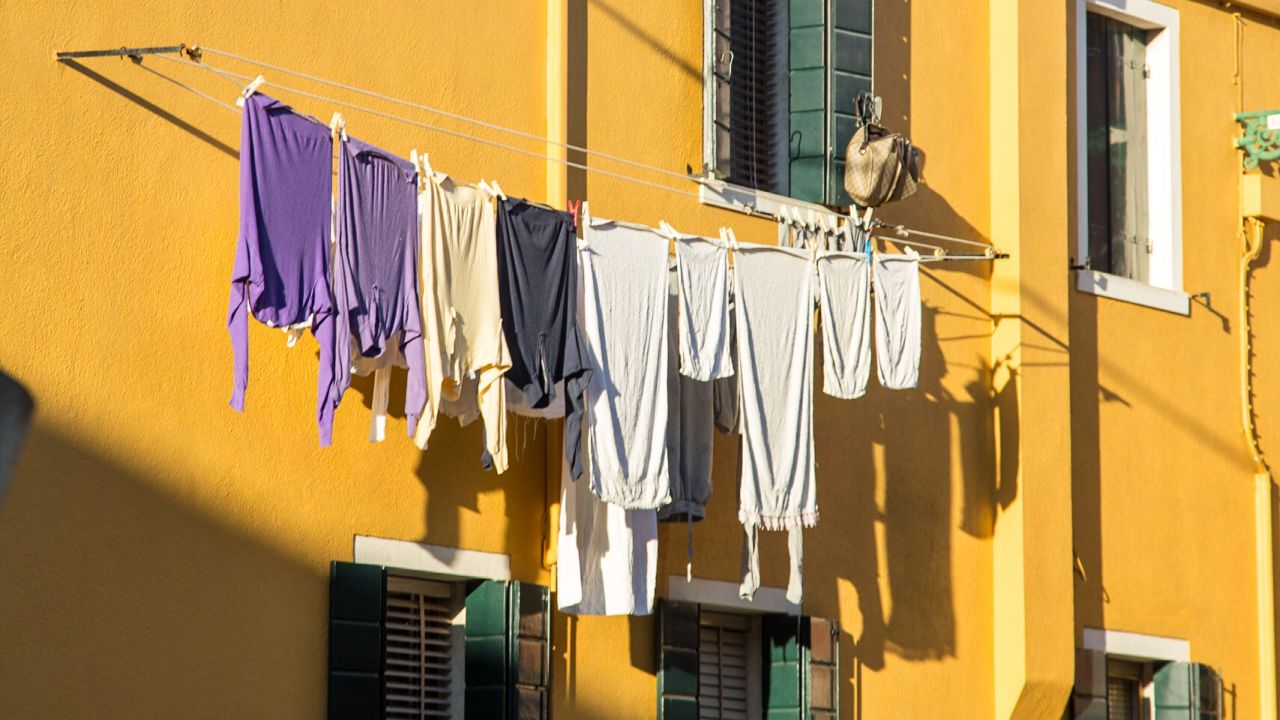 Clothes hang above the alleyways on the Venetian island of Burano.