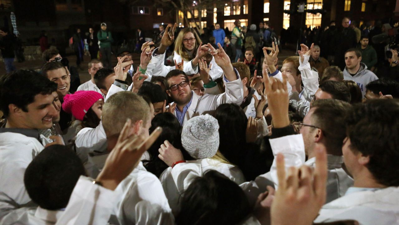 Dental students make the North Carolina State University Wolfpack sign following a candlelight vigil in Chapel Hill on February 11. One of the victims, Razan Mohammad Abu-Salha, was studying architecture at North Carolina State. Another, Deah Shaddy Barakat, was a second-year student at the University of North Carolina School of Dentistry. His wife, Yusor Mohammad, had recently been accepted to study there next year.