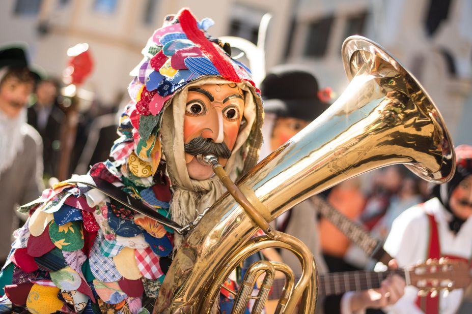 A performer wearing a wooden mask takes part in the annual Carnival parade in Mittenwald, Germany, on February 12.