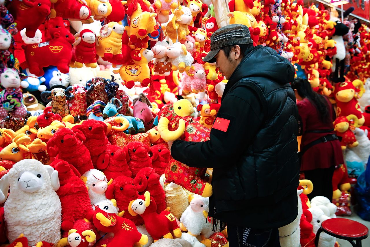 Shoppers in Beijing buy holiday decorations Thursday, February 12, as the Lunar New Year, a massive celebration in many Asian countries, quickly approached.