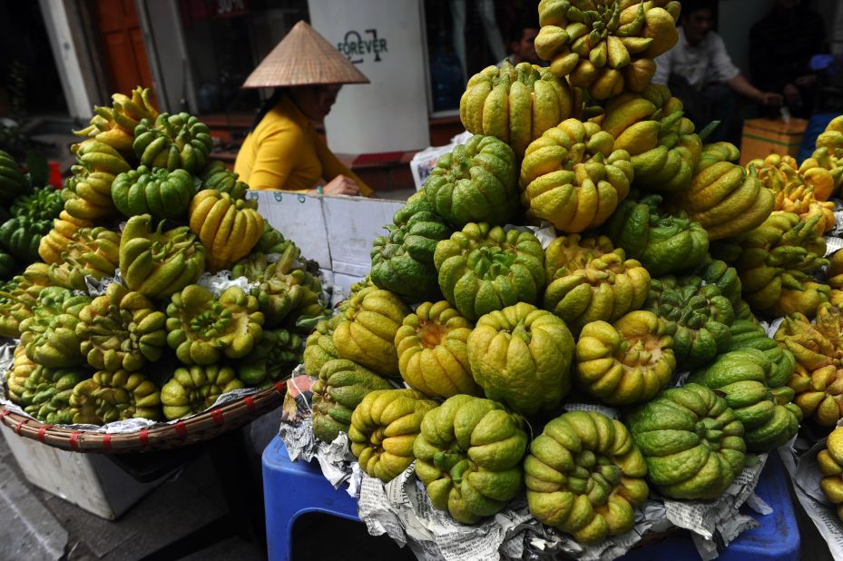 A woman sells "Buddha hand" fruits for Tet, or Vietnamese Lunar New Year, in downtown Hanoi, Vietnam, on February 12.