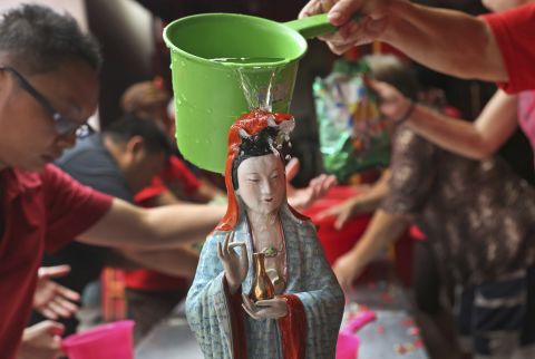 A Chinese god statue is cleaned at a temple in Jakarta, Indonesia, on February 12.