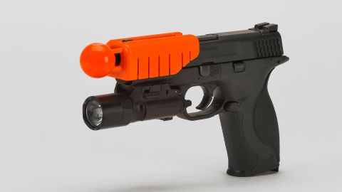 New weapons technology called "The Alternative" attaches to a muzzle of an officer's gun.