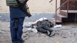 A police expert checks a dead person killed as a result of shelling in the eastern Ukrainian town of Kramatorsk in the Donetsk region on February 10, 2015. At least six civilians were killed and 21 wounded in a rocket attack on Ukraine's military headquarters in the wartorn east, local authorities said. The attack also hit residential areas of Kramatorsk, which is considered to be under firm Kiev control. AFP PHOTO / SERGEY BOBOKSERGEY BOBOK/AFP/Getty