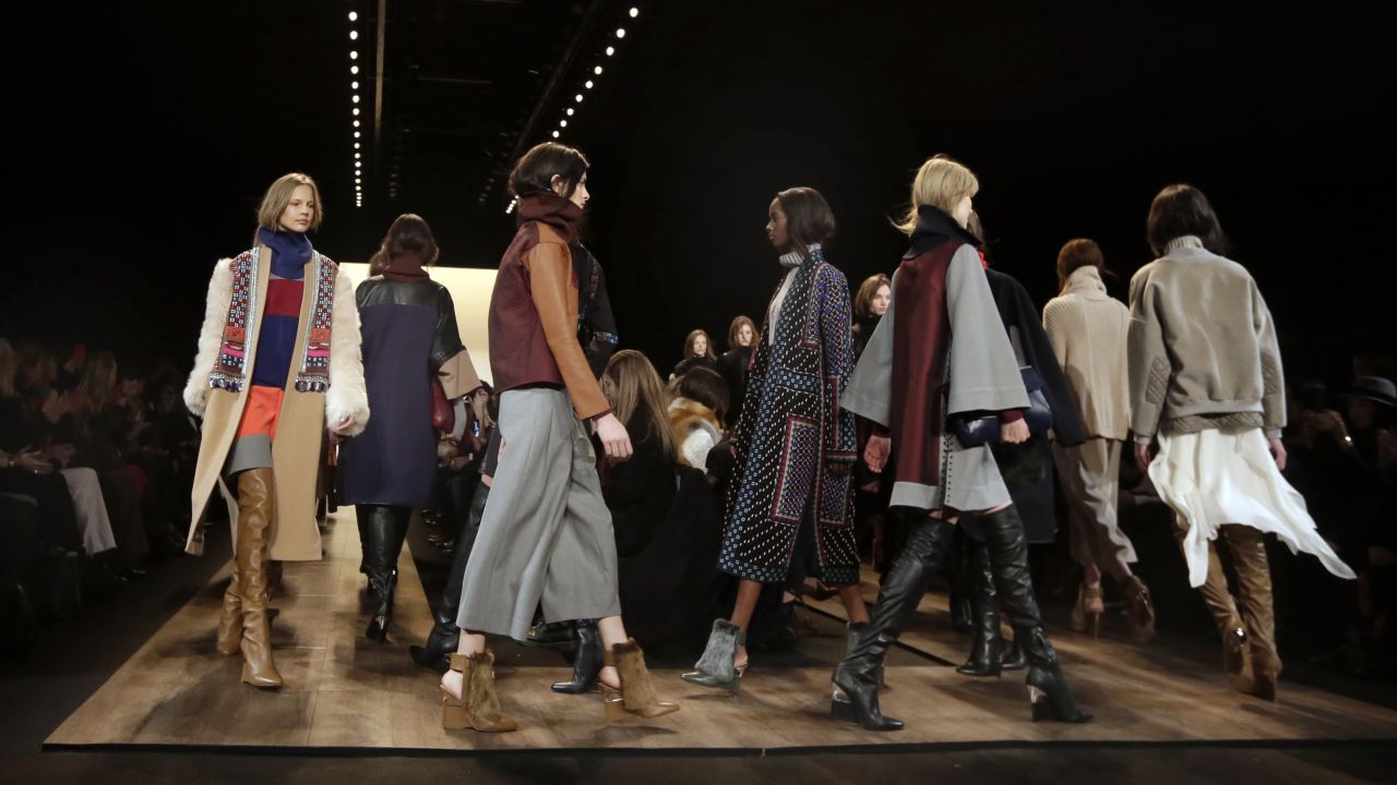 Models in over-the-knee boots, statement coats and cozy knits walk the finale of the BCBG Max Azria show on the first day of the event.