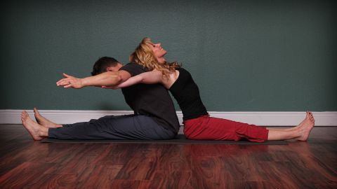 This yoga position lengthens low-back and hamstrings, alternately opens chest and front of shoulders