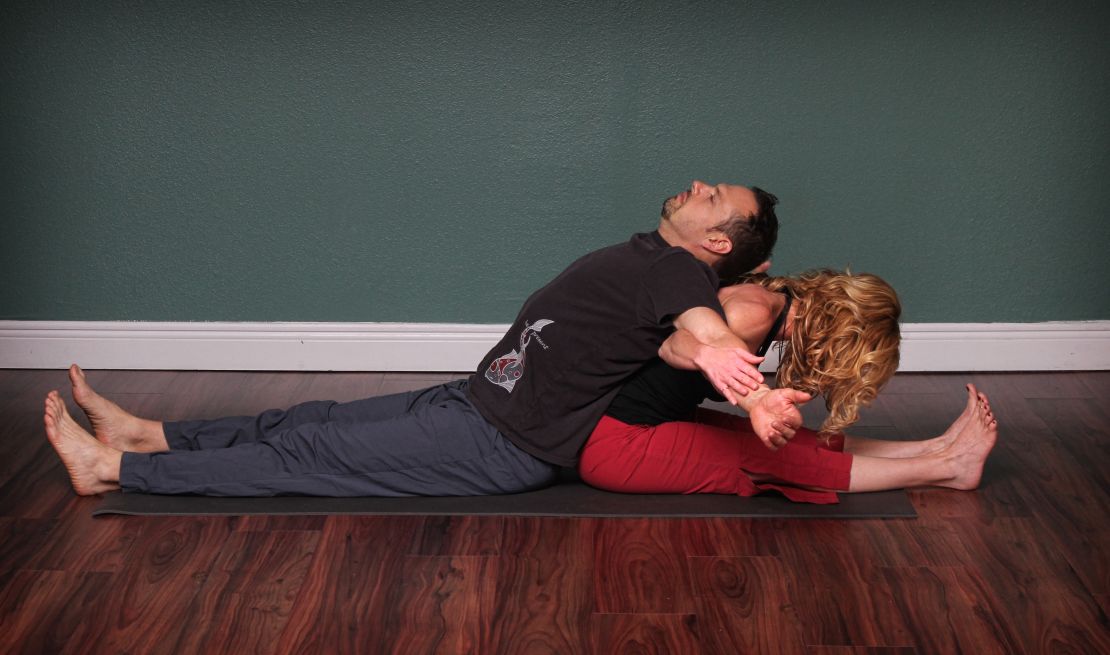 This position lengthens lower-back and hamstrings, alternately opens chest and front of shoulders