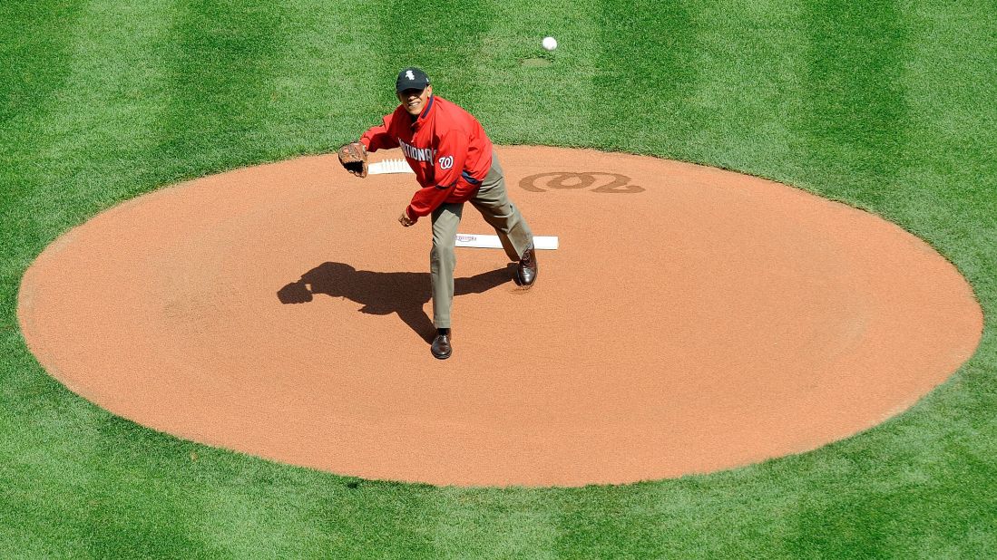 Obama throws out the opening pitch before a baseball game between the Philadelphia Phillies and the Washington Nationals in April 2010.