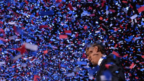 Obama celebrates on stage in Chicago after defeating Romney on Election Day in 2012.