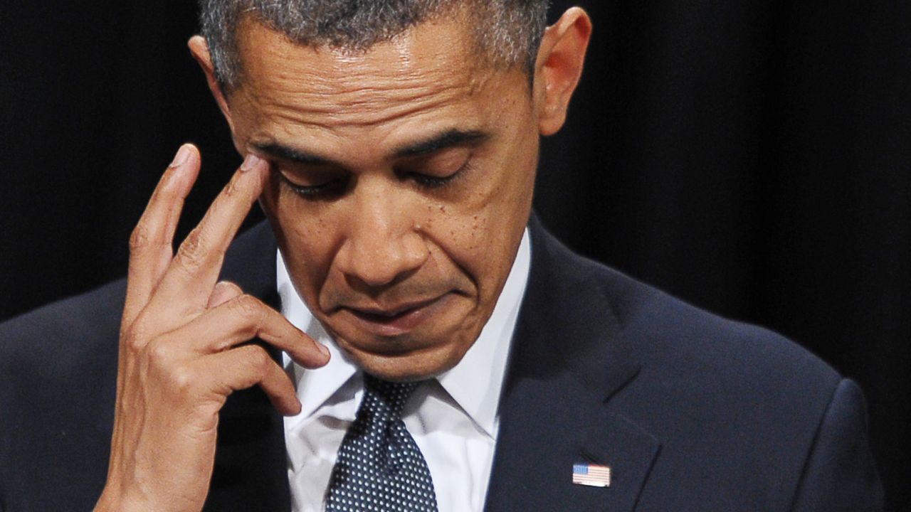 Obama pauses during his speech at a memorial service for the victims of the Sandy Hook Elementary School massacre in December 2012.