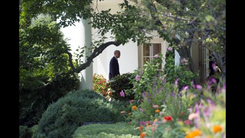 Obama walks to the Oval Office on August 7, 2014, the same day he announced the beginning of airstrikes on ISIS.
